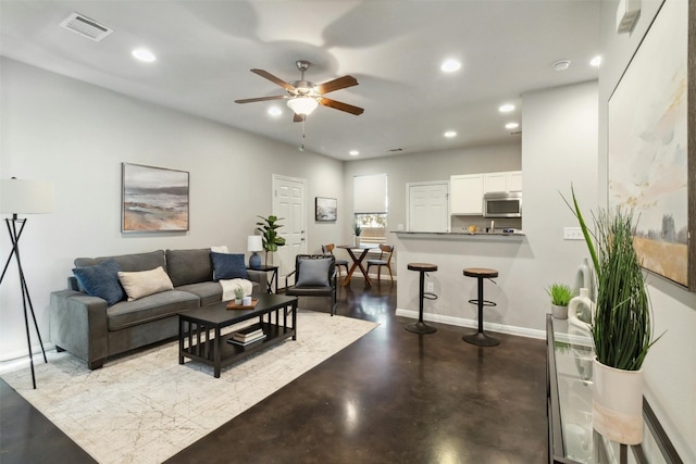 living room featuring ceiling fan