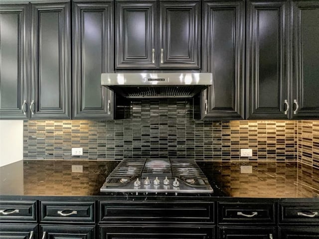 kitchen featuring tasteful backsplash, stainless steel gas stovetop, and ventilation hood