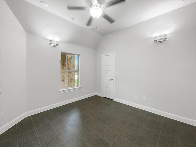 spare room with ceiling fan and lofted ceiling