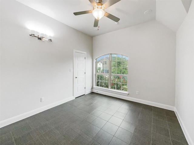 tiled spare room featuring ceiling fan and lofted ceiling