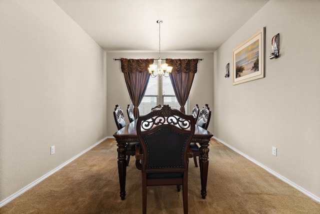 dining space with a chandelier and carpet