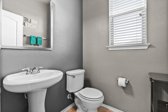 bathroom with sink and toilet