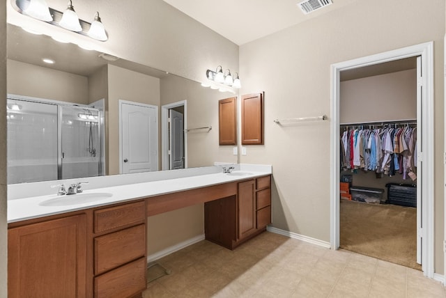 bathroom with walk in shower and vanity