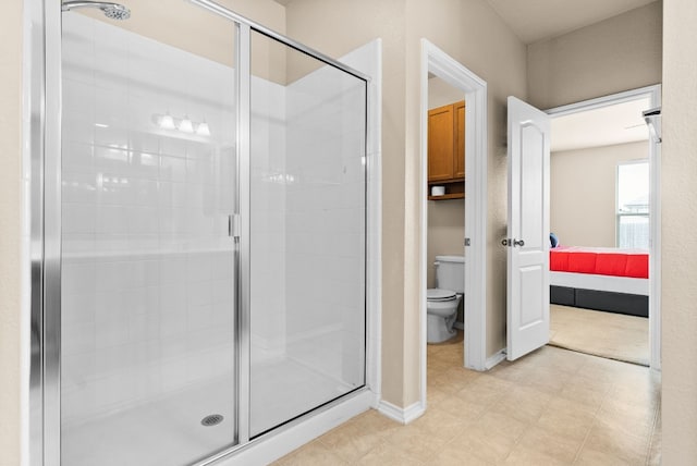 bathroom with toilet and walk in shower