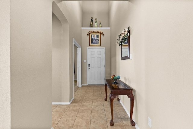 entryway with light tile patterned flooring