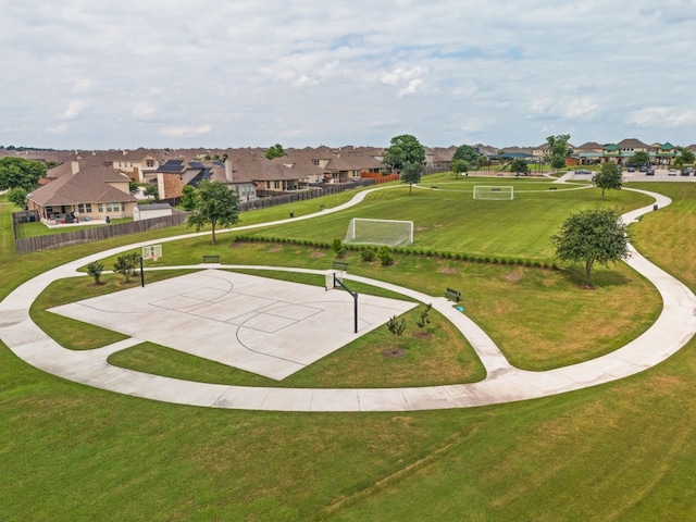 view of property's community with basketball hoop