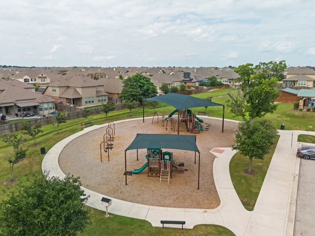 view of playground with a lawn