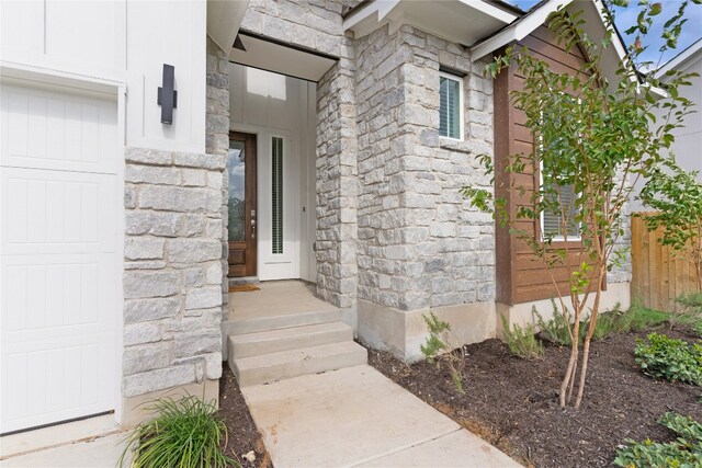 property entrance featuring a garage