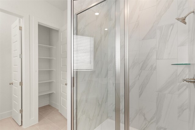 bathroom featuring tile patterned floors and an enclosed shower