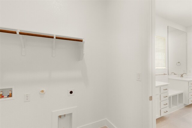 clothes washing area with light tile patterned floors, gas dryer hookup, hookup for a washing machine, hookup for an electric dryer, and sink