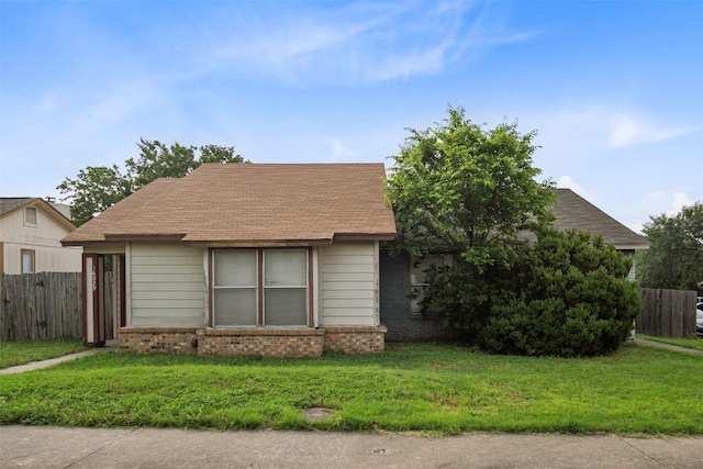 view of front of home with a front lawn