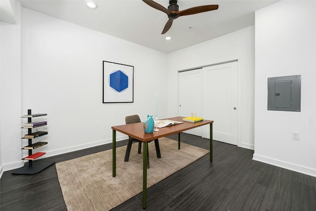 office featuring ceiling fan, electric panel, and dark wood-type flooring