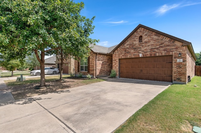 view of front of house with a front yard and a garage