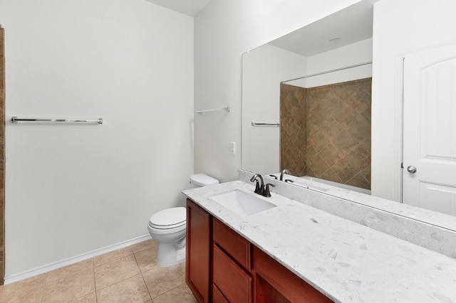 bathroom with vanity, toilet, and tile patterned flooring