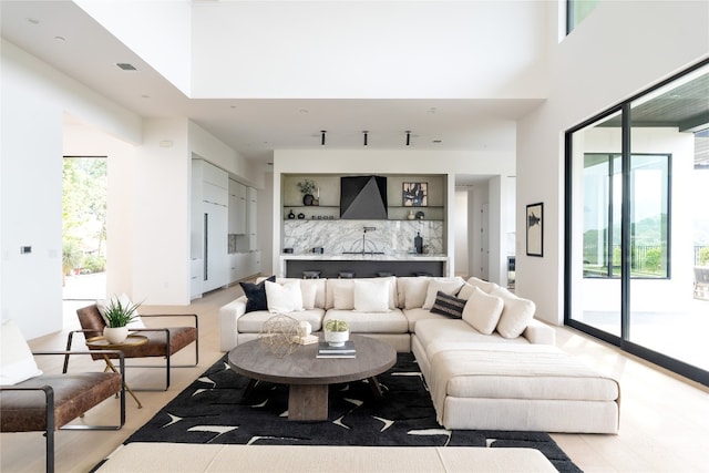 living room with a high ceiling