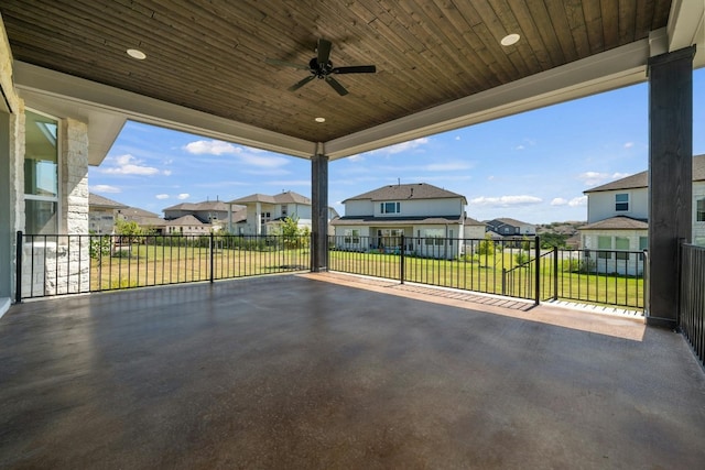 view of patio featuring ceiling fan and a residential view