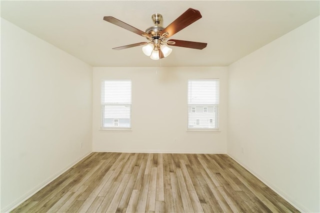 spare room featuring ceiling fan and light hardwood / wood-style floors