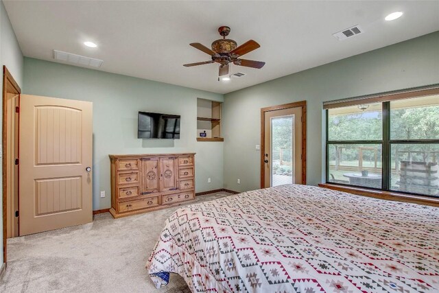 carpeted bedroom featuring access to exterior and ceiling fan