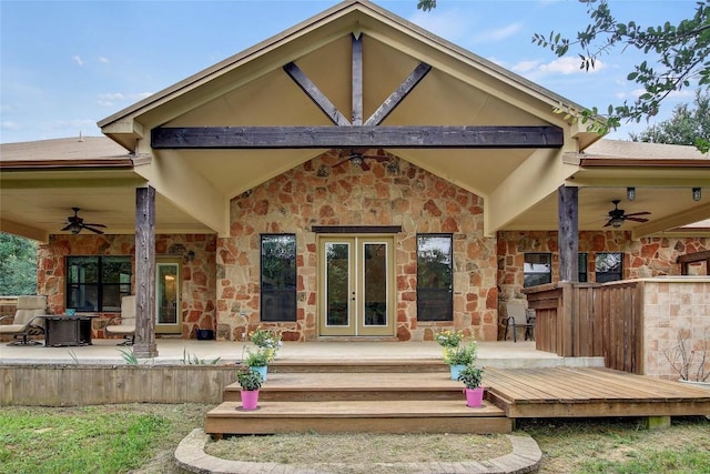 back of house with french doors and ceiling fan