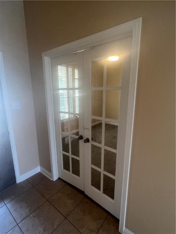 doorway to outside featuring tile patterned flooring and french doors