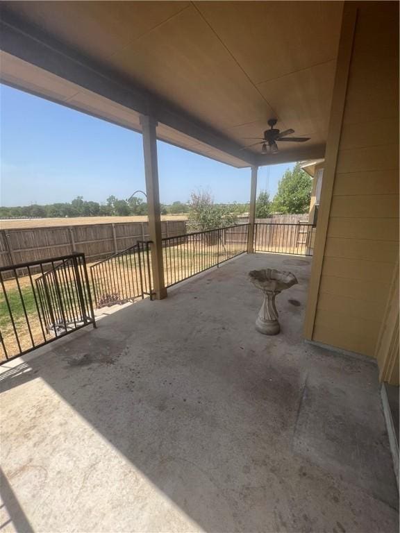 view of patio featuring ceiling fan