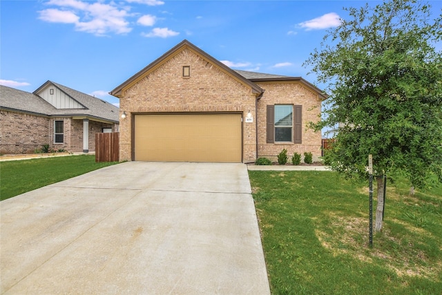 view of front of house with a front yard and a garage