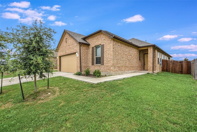 view of front of house with a garage and a front lawn