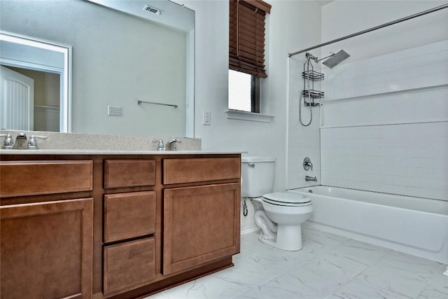 full bathroom with vanity, tiled shower / bath, and toilet