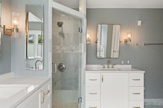 bathroom featuring vanity and an enclosed shower