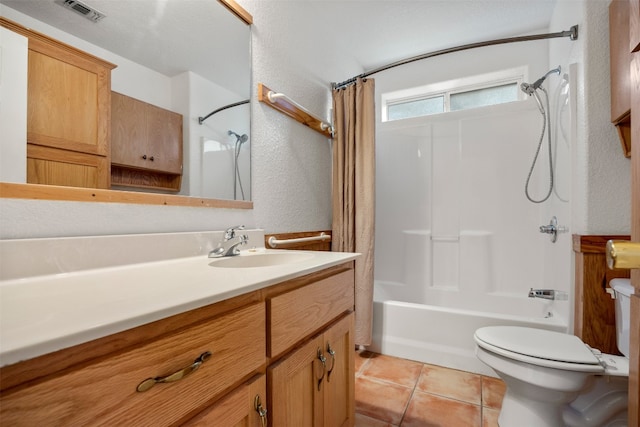 full bathroom featuring tile patterned flooring, shower / bath combination with curtain, vanity, and toilet