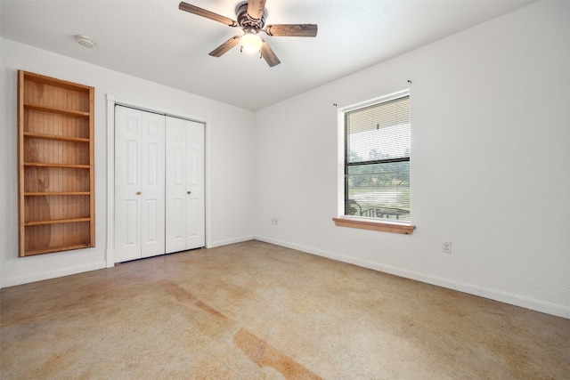 unfurnished bedroom with ceiling fan, carpet floors, and a closet