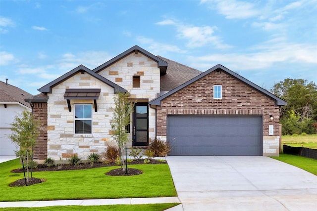 view of front of property featuring a front yard and a garage