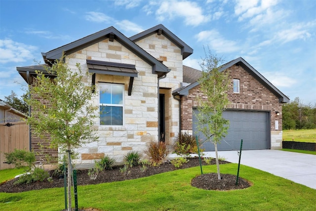 view of front of home featuring a garage and a front yard