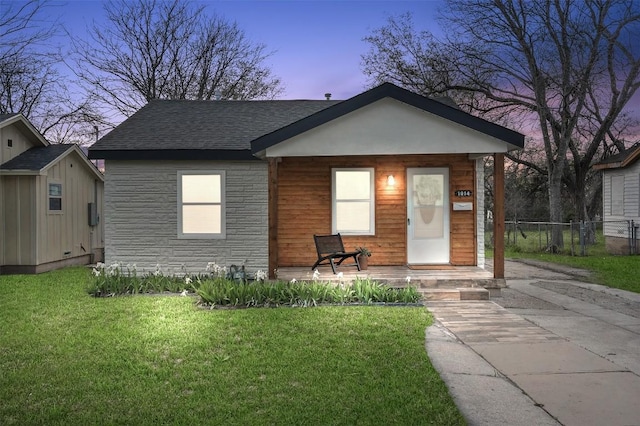 view of front of property with a yard