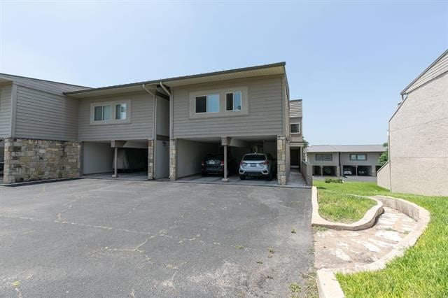 view of side of home featuring a carport