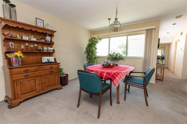 view of carpeted dining area