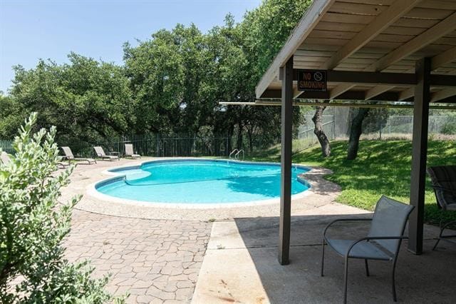 view of swimming pool featuring a patio area