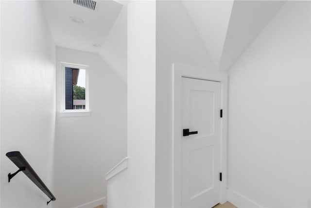 hallway with vaulted ceiling