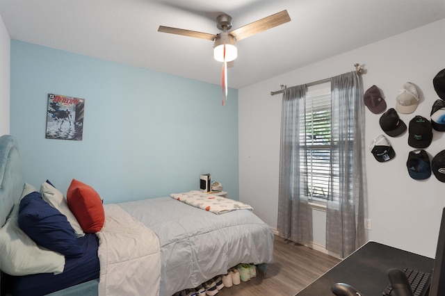 bedroom featuring ceiling fan and hardwood / wood-style floors