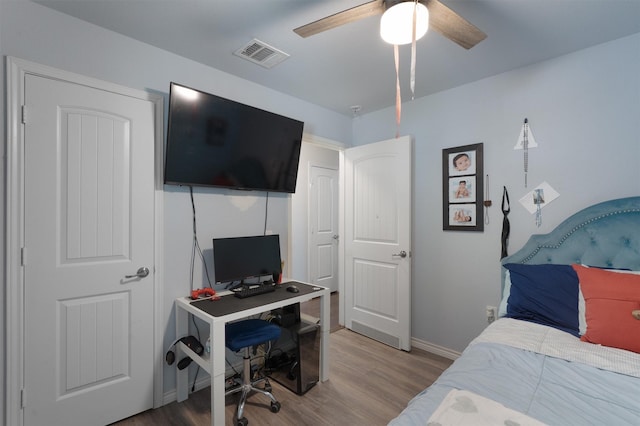 bedroom featuring ceiling fan and hardwood / wood-style flooring