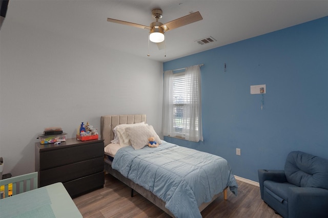 bedroom featuring ceiling fan and hardwood / wood-style floors