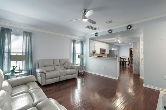 living room with ceiling fan, dark hardwood / wood-style flooring, a wealth of natural light, and ornamental molding