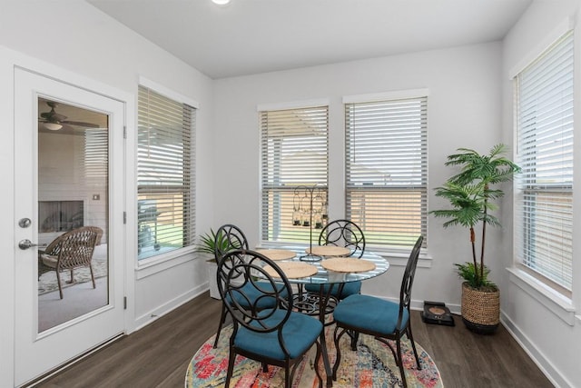 dining space featuring dark wood-type flooring