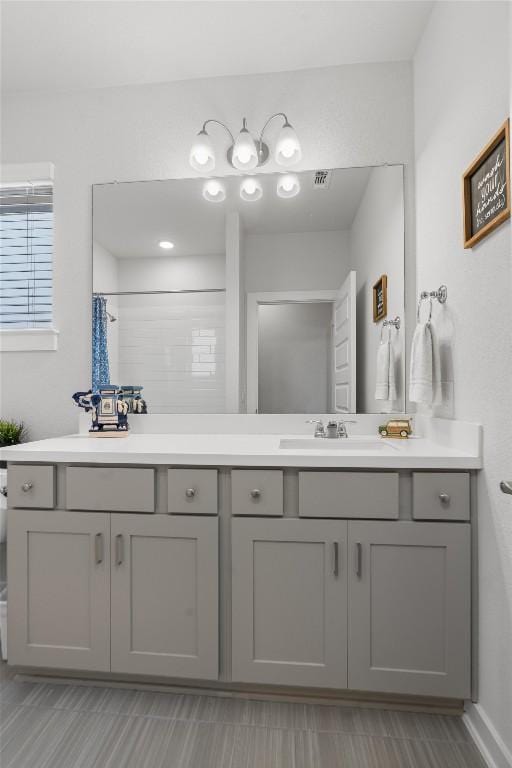 bathroom featuring vanity and walk in shower