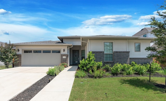 view of front of property with a garage and a front lawn