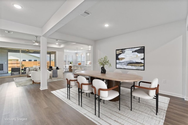 dining room with wood-type flooring and ceiling fan