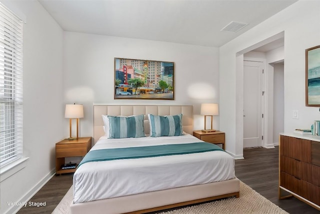 bedroom featuring dark hardwood / wood-style floors