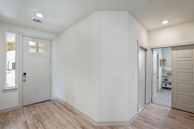 entryway with light hardwood / wood-style floors