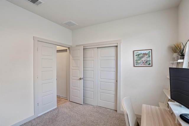 home office featuring light carpet