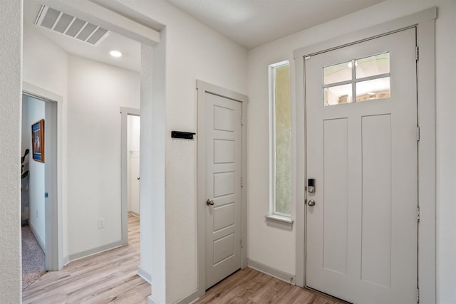 foyer entrance featuring light wood-type flooring